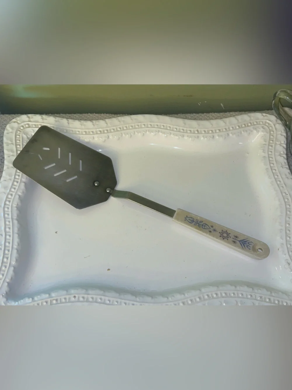 Vintage Ace kitchen spatula turner with decorative blue folk art handle